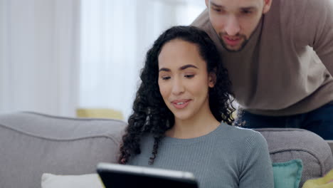 Couple,-talking-and-relax-on-tablet-on-sofa