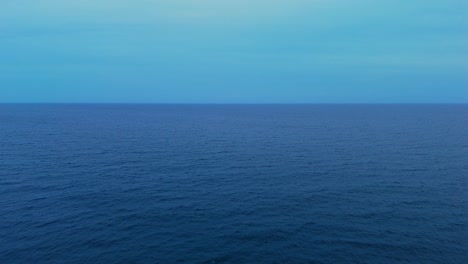 clear blue ocean water blending into the horizon, a serene and open view perfect for backgrounds