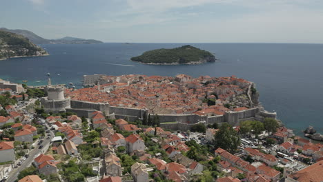 approaching the entire walled city of old town dubrovnik with view of the adriatic sea.