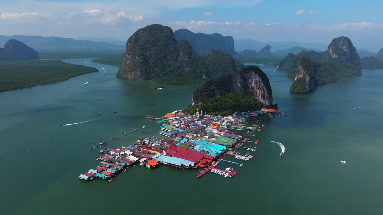 Koh Panyee Village By The Ocean With Scenic Views Of Limestone Islands In Phang Nga Bay, Thailand. - aerial shot