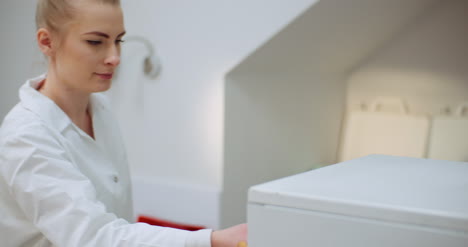 female doctor looks for personal data in the file 1