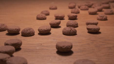 traditional dutch candy rolling on a wooden surface