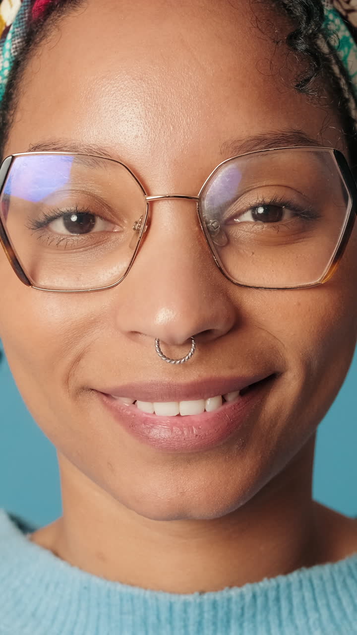 Close-up Portrait of Happy Young Woman with Glasses Smiling