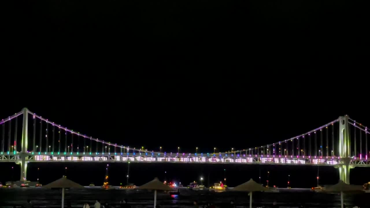 Busan Travel, Vacation, Nightlife Attractions. Gwangan Bridge In Gwangalli Beach Welcomes Visitors To The 29th Busan International Film Festival.