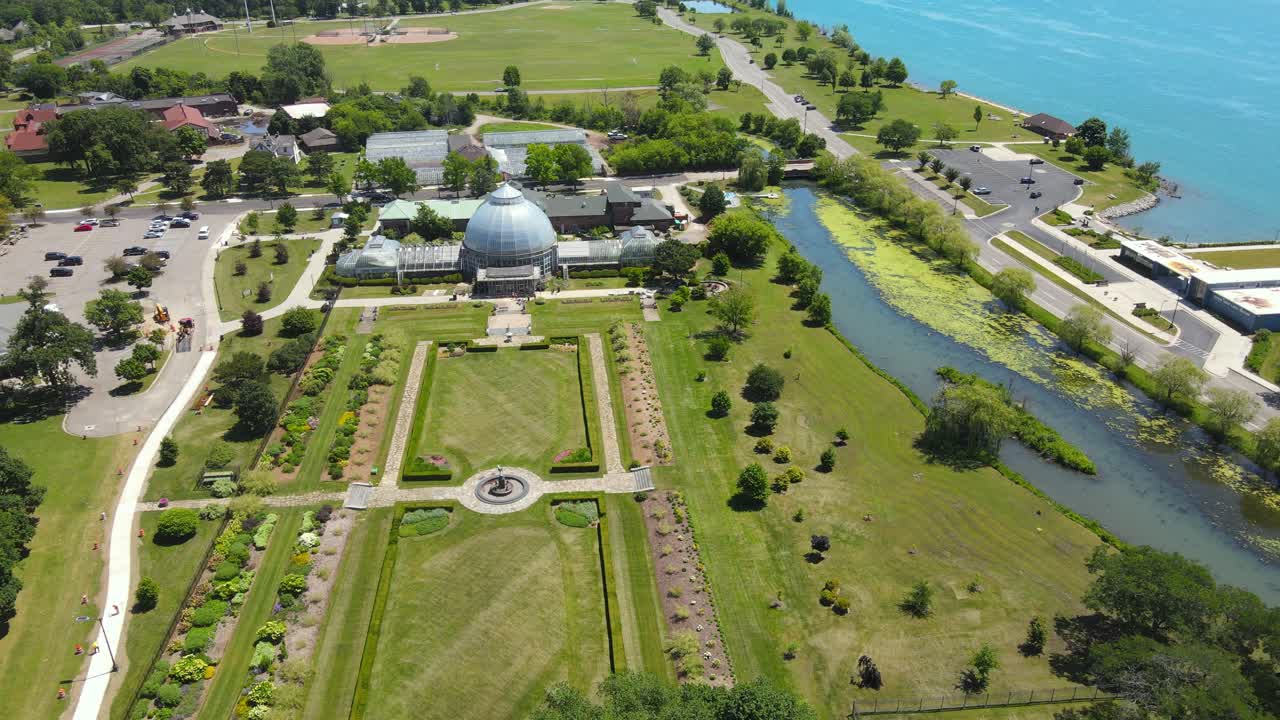 Aerial approaching shot of Anna Scripps Whitcomb Conservatory on Belle Isle