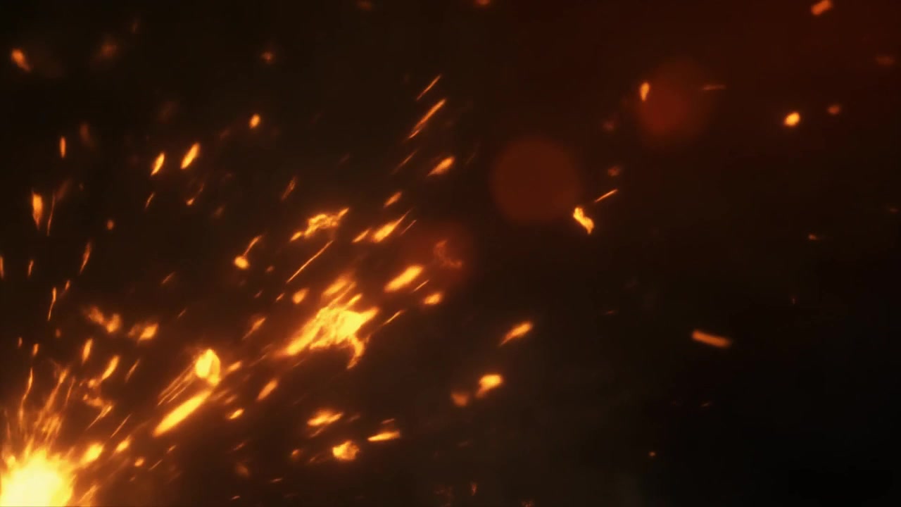 Glowing Orange Sparks Flying Against Dark Background