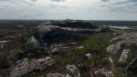 rocky terrain in chaval, ceara, with lush greenery and distant hills visible