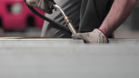 welding metal frame in a steel factory - fabrication process - close up