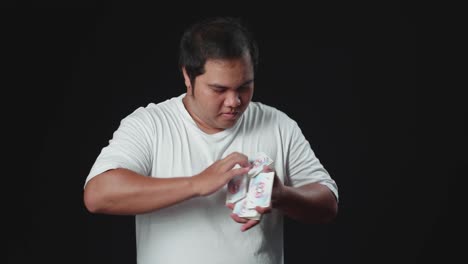 asian man starts showing his trick with cards
