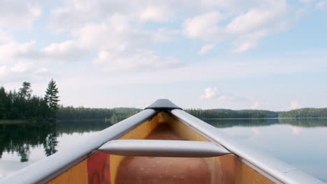 Canoe-Point-Of-View-On-A-Beautiful-Calm-Lake