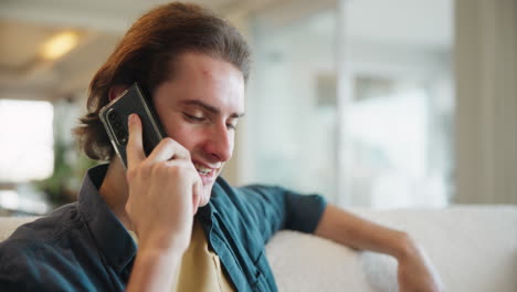 a man is on a phone call indoors