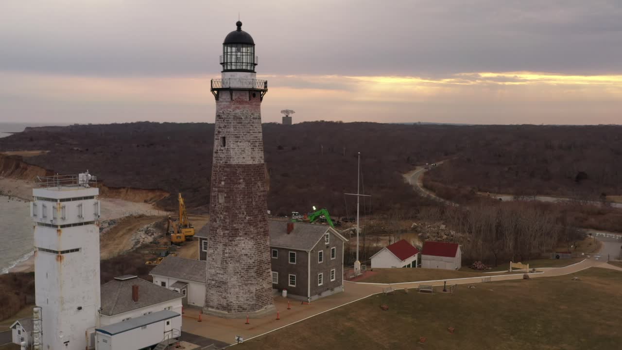 An aerial view of the Montauk lighthouse during a cloudy sunset