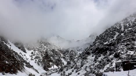 clouds move around high atlas mountains morocco