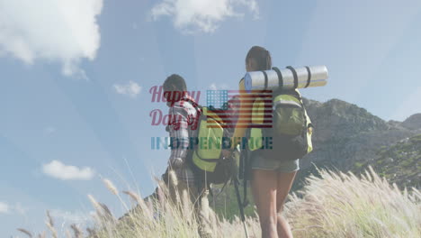 animation of independence day text over smiling diverse couple hiking