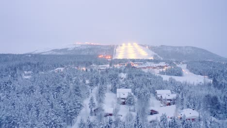 Police-incident-accident-crash-on-road-drone-aerial-flyover,-Levi,-Finland-village-snowy-neighborhood