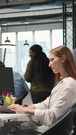 vertical video pleased supervisor praises junior dev work, fostering positive office culture