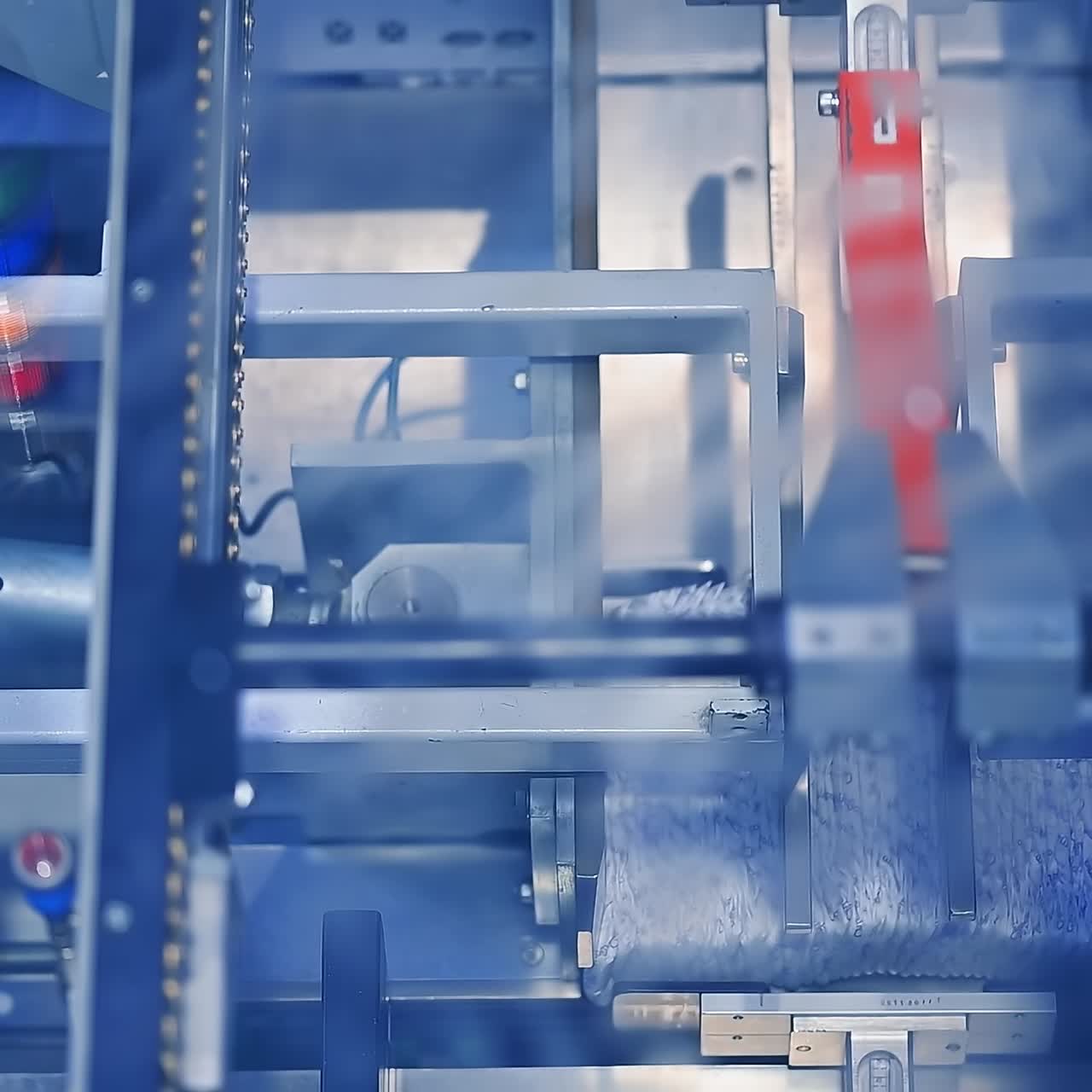 Factory industrial making pampers. A large roll of cellulose producing diapers