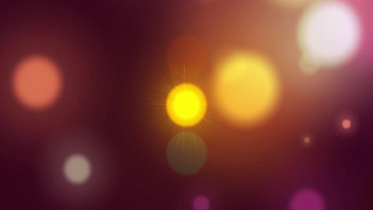 Glowing light orbs and bokeh effects animation on dark background
