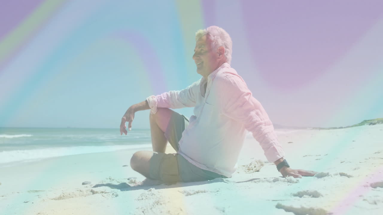 senior man leaning back on sand, displaying animated health chart and heart icon