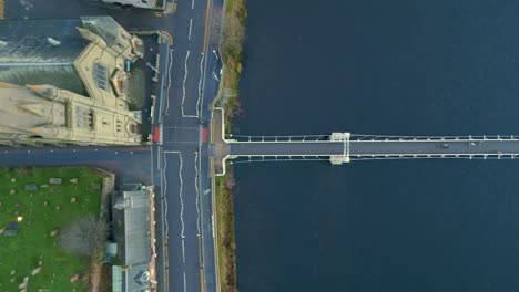 flying above grieg street bridge across the river ness from old high church inverness