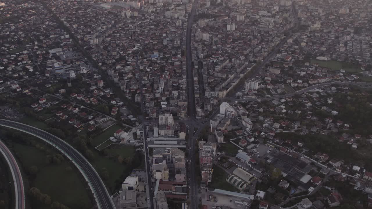 Reveal shot of Shkod&euml;r city Albanian during sunrise, aerial