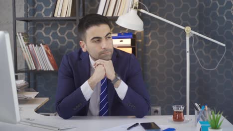 Thoughtful-businessman-working-in-the-office.