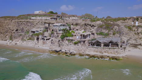 The-Artistic-House---Sidna-Ali-Beach,-Herzliya-is-a-Beautiful-complex-made-of-limestone-on-a-cliff-next-to-a-distant-beach---parallax-shot