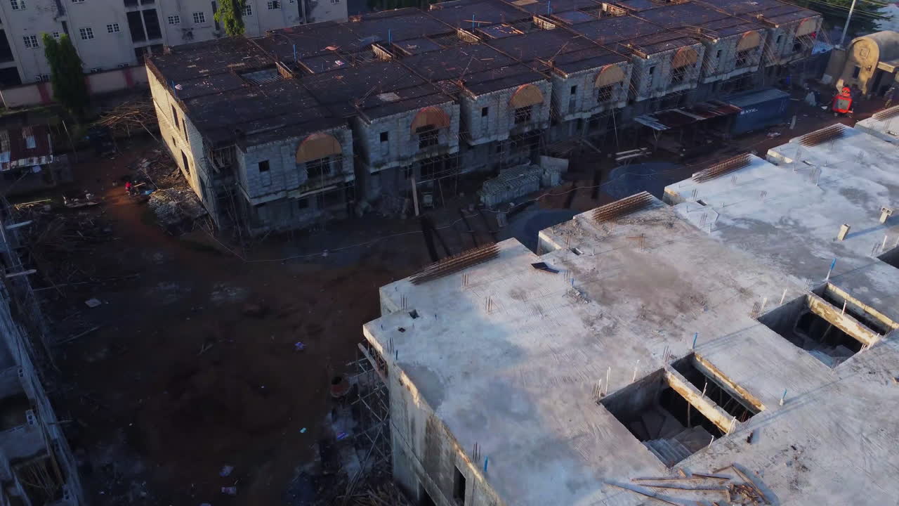 Beautiful aerial of a newly developed suburban neighborhood with new homes under construction on a sunny day