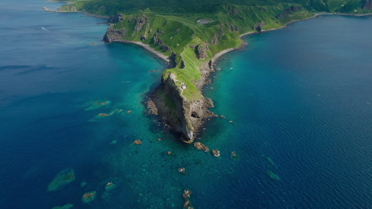 Aerial establishing fly Japanese sea capes in Shakotan Hokkaido, blue pristine sea, summer travel island