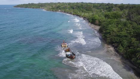 aerial view of shipwreck on tropical beach
