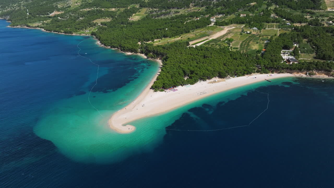 The Zlatni Rat Stunning Beach On The Southern Coast Of The Croatian Island Of Brac. Aerial Drone Shot