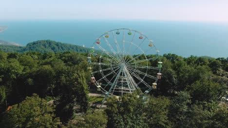 ferries wheel on a mountain overlooking the sea