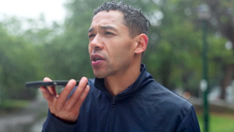 man talking on phone in the rain