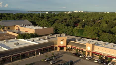 Drone-view-flying-away-from-Silver-Sands-Outlet-Mall-in-Destin-FL