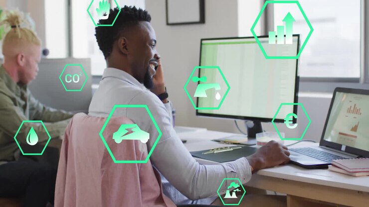 Animation of ecology icons over diverse colleagues working in office