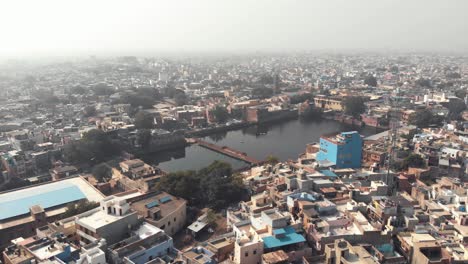 Colorful-roofs-and-Houses-In-Jodhpur,-India---aerial-drone