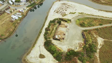 A-rotating-aerial-view-of-a-set-of-waterfront-oil-pumpjacks