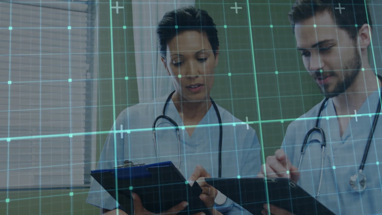 Reviewing patient charts, healthcare professionals using digital data overlay in hospital