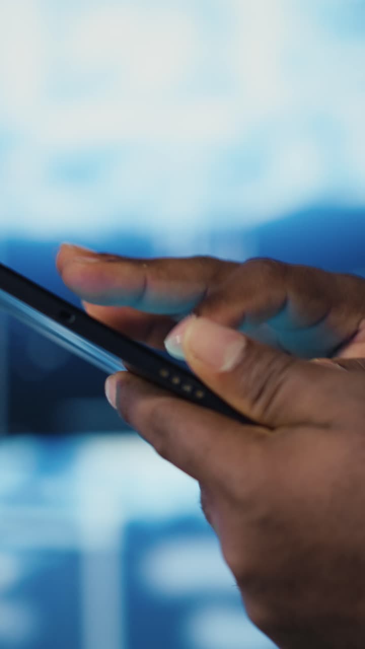 Close Up of African American Hands Using Smartphone