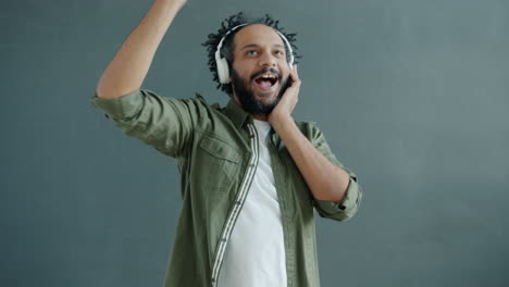 man dancing and listening to music