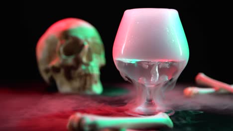 cognac glass with the effect of dry ice at black background