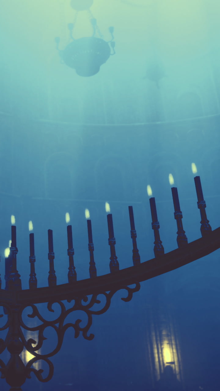 Candles light up underwater space during an evening event in a hall