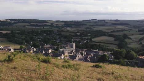 Static-Wide-shot-of-English-Country-Village-viewed-from-hilltop-in-the-sunshine