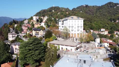 forestry mountain and village of brunate in north italy, aerial view