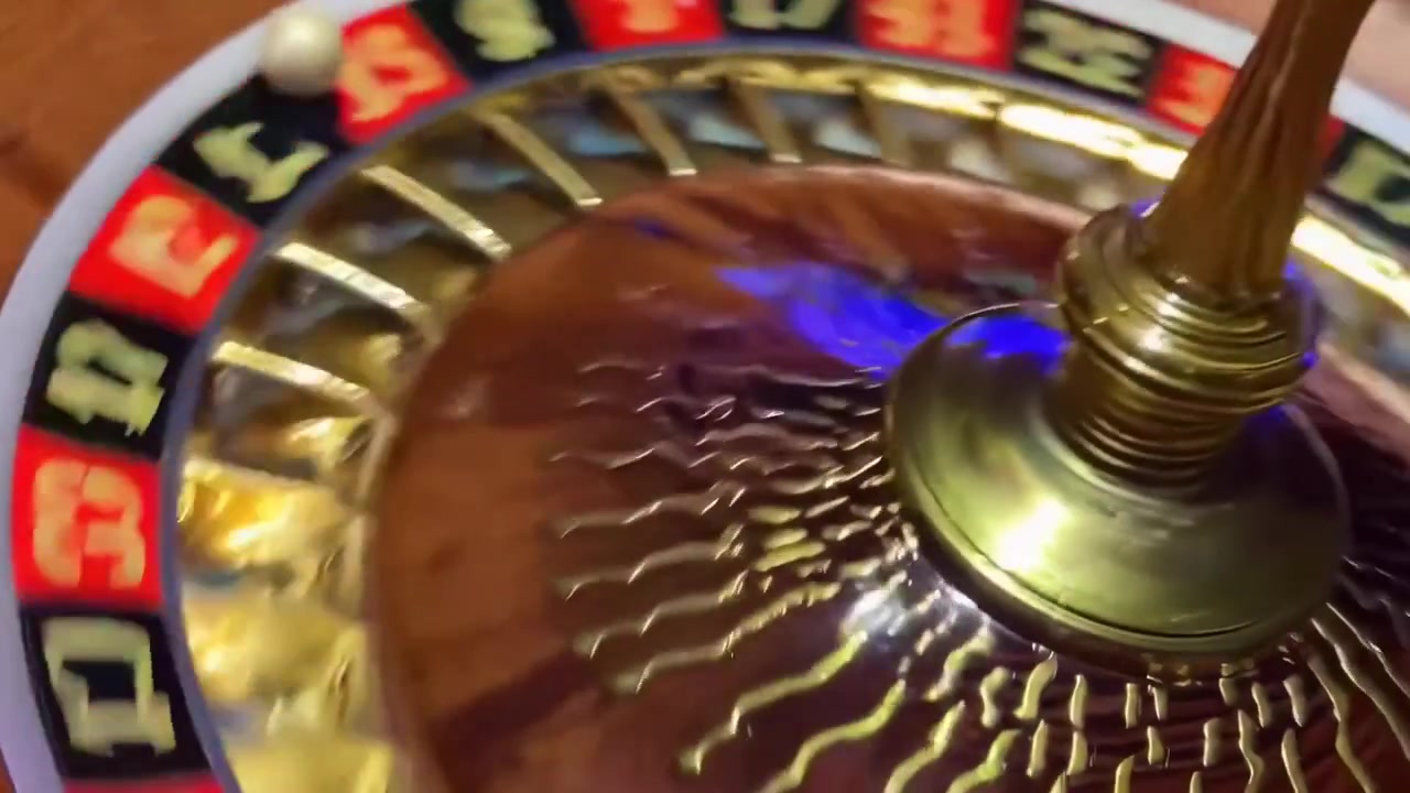 Spinning Roulette Wheel with Ball Rolling in Casino