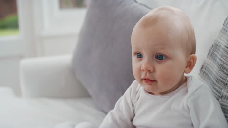 portrait happy baby with beautiful blue eyes looking curious toddler smiling enjoying life healthy little infant at home 4k