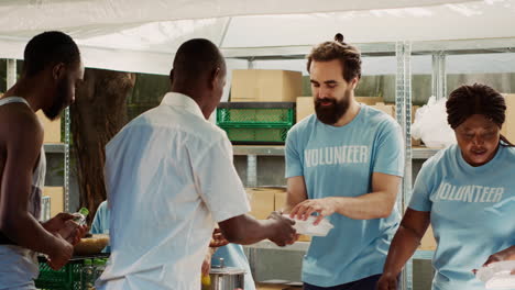 volunteers serve food to underprivileged