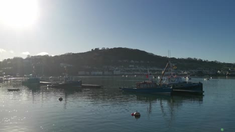 fishing boats on the river teign in teignmouth on a bright summer's day, devon, uk