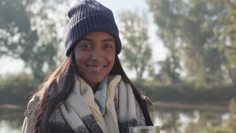 nature, happy and face of a woman by a lake