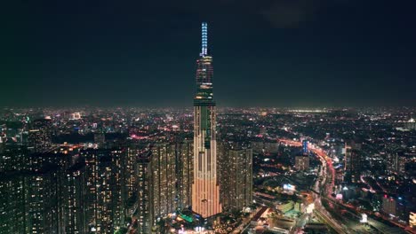 Drone-view-Landmark-81-tower-at-night---Ho-Chi-Minh-city,-south-Vietnam